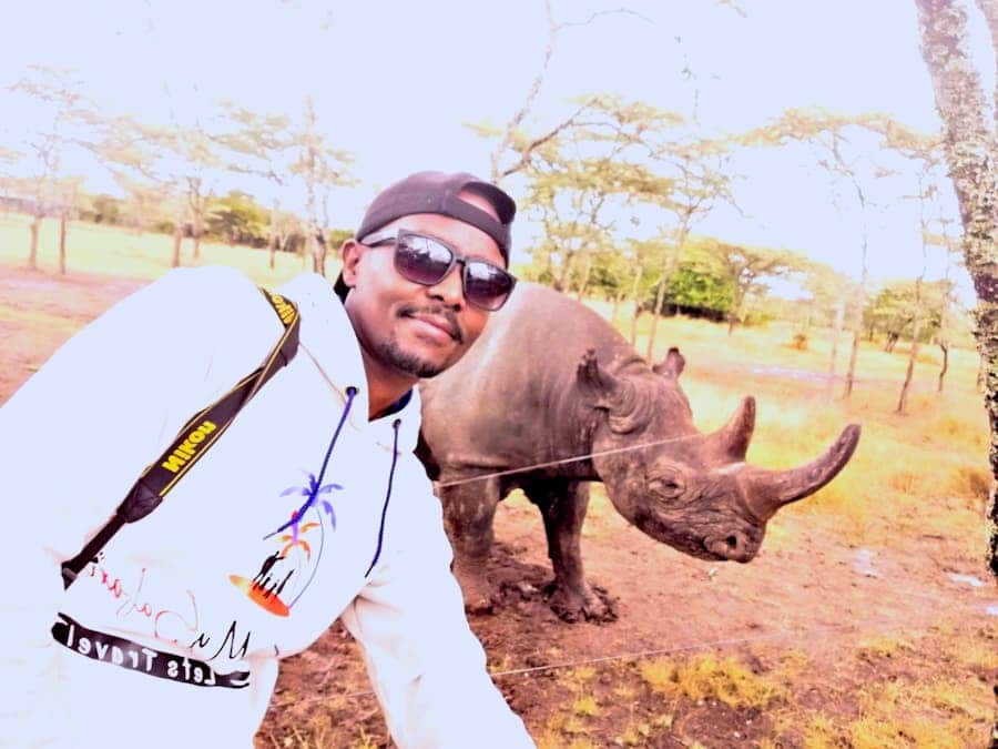 Mr Ease Posing with Baraka the Blind Rhino at Ol Pejeta
